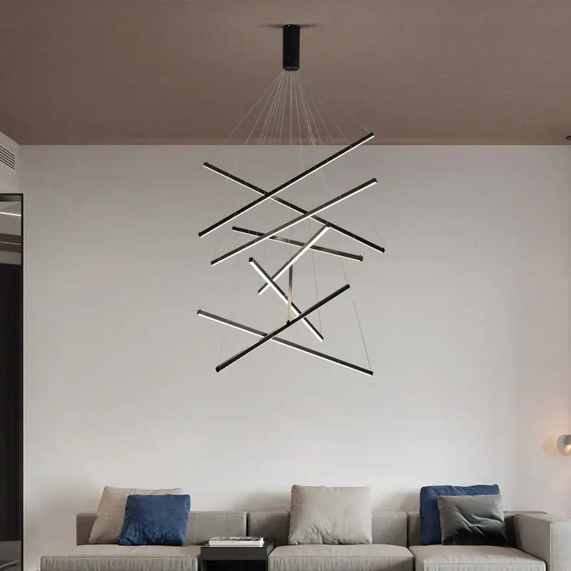 Modern black and white aluminum ceiling chandelier with intersecting rods and LED changeable shape design suspended by cables