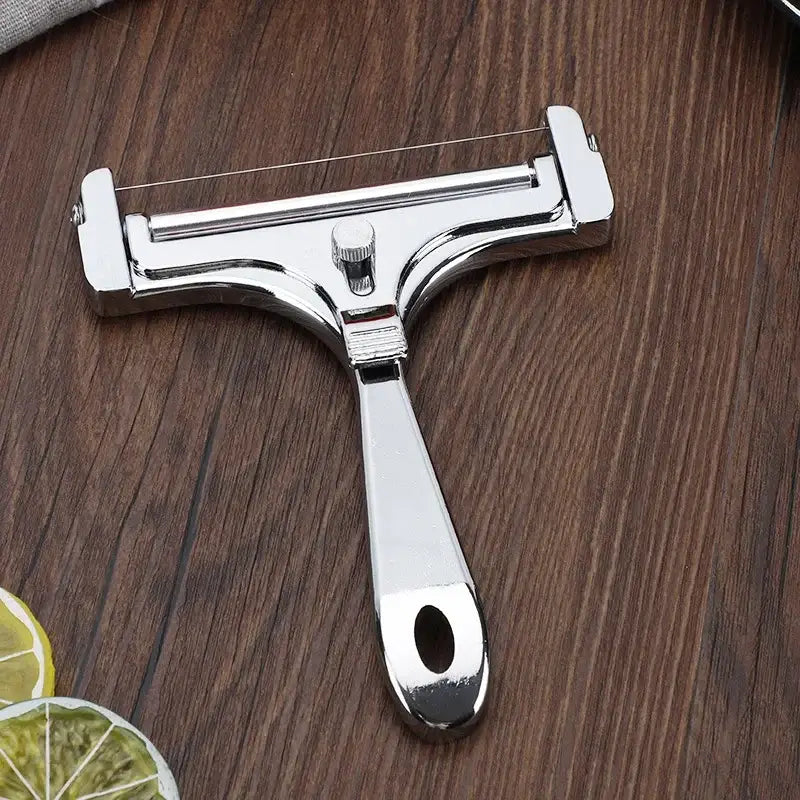 Shiny chrome aluminum cheese butter slicer with ergonomic handle and adjustable tension knob for precise cutting