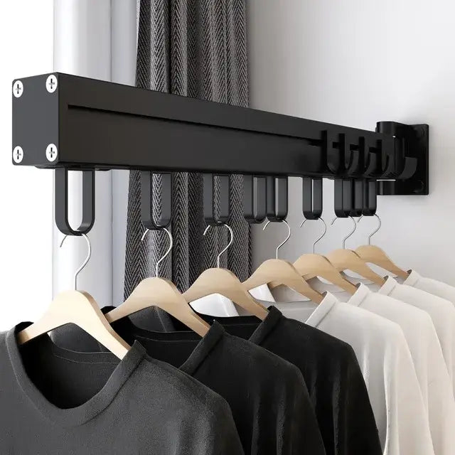 Black metal sliding hanger organizer rack with multiple hooks and wooden hangers for aluminum clothing storage