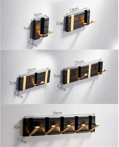 Modern black and gold aluminum folding robe hook with sleek minimalist design for wall mount by DecorBites