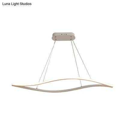 Modern white led pendant light with a sleek, curved design and thin suspension cords.