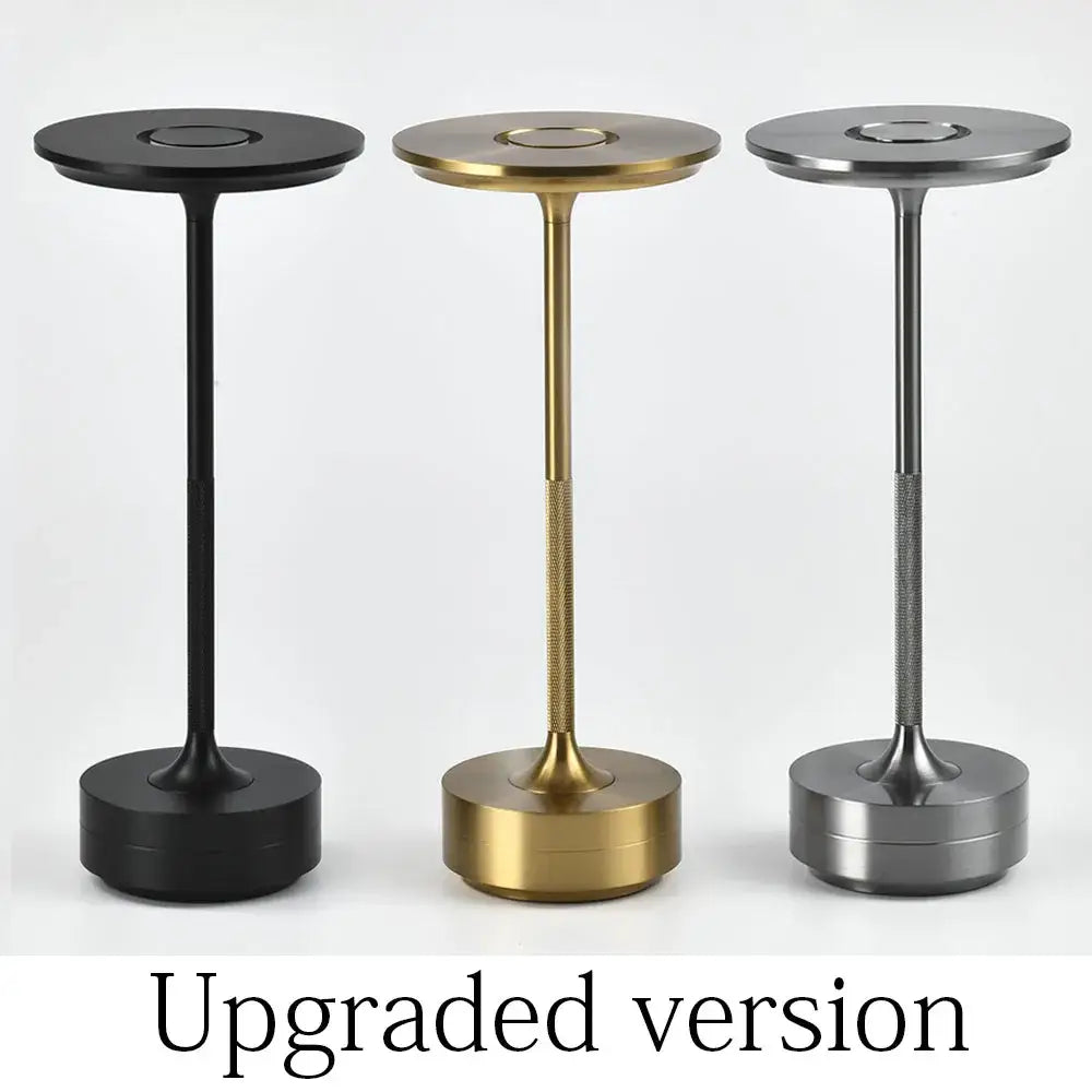 Three sleek decorbites aluminum led desk lamps in black gold and silver with textured midsections for living room use