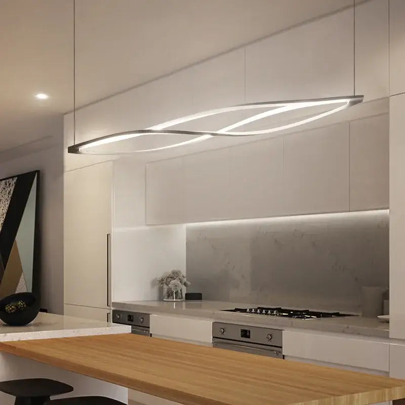 Modern silver aluminum led pendant lamp with sleek flowing design and integrated lighting for kitchen dining island