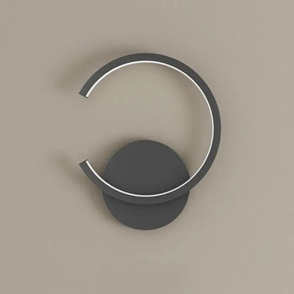Modern minimalist aluminum led wall lamp with dark gray circular base and illuminated white led ring for home decor