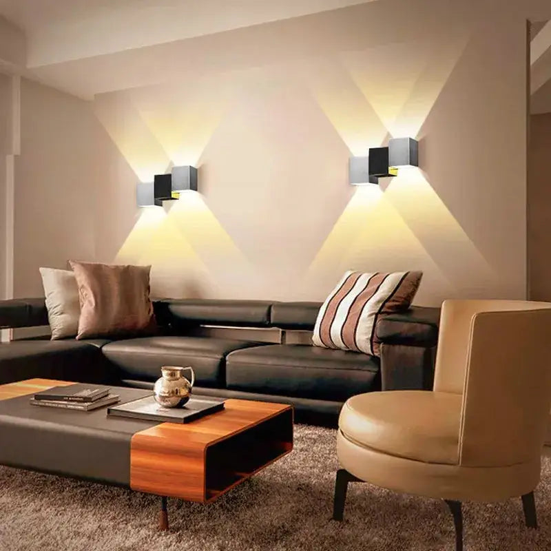 Modern black and silver aluminum led wall lamp with geometric design and warm up and down focused lighting for living room