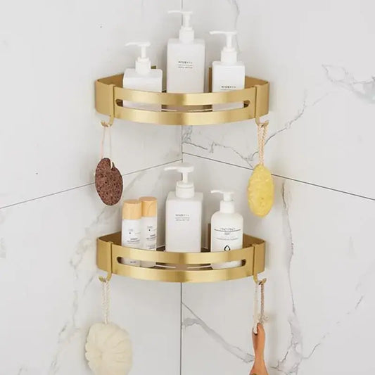 Gold-colored two-tiered decorbites aluminum shower shelf with brushed aluminum finish and open slotted design for bathroom corner