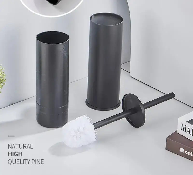 Decorbites™ aluminum toilet brush holder set in brushed gold and black featuring a black toilet brush with white bristles