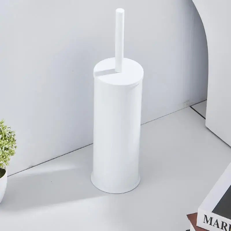 White cylindrical plastic toilet brush holder with matching handle from the DecorBites aluminum brush holder set