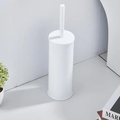 White cylindrical plastic toilet brush holder with matching handle from the DecorBites aluminum brush holder set