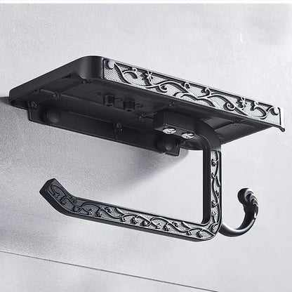Black ornate aluminum toilet paper holder with intricate scrollwork design and phone rack in decorbites™ collection