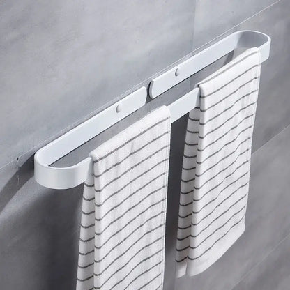 White plastic towel holder with two white towels on decorbites aluminum towel holder matte black wall mounted bar
