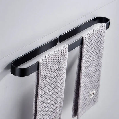 DecorBites aluminum towel holder matte black wall mounted towel bar with black matte finish holding two gray towels