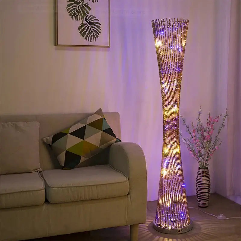 Tall slender decorbites aluminum tower floor lamp with golden metallic frame and warm yellow and cool purple led lights