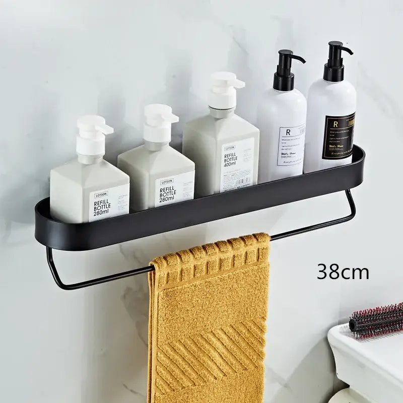 DecorBites™ black metal bathroom shelf with towel bar and corner storage shelf holding towel and pump bottles