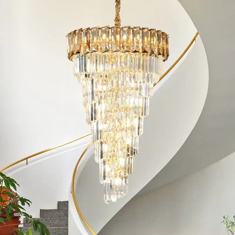 DecorBites amber crystal chandelier with cascading clear and gold-toned glass prisms hanging from braided rope
