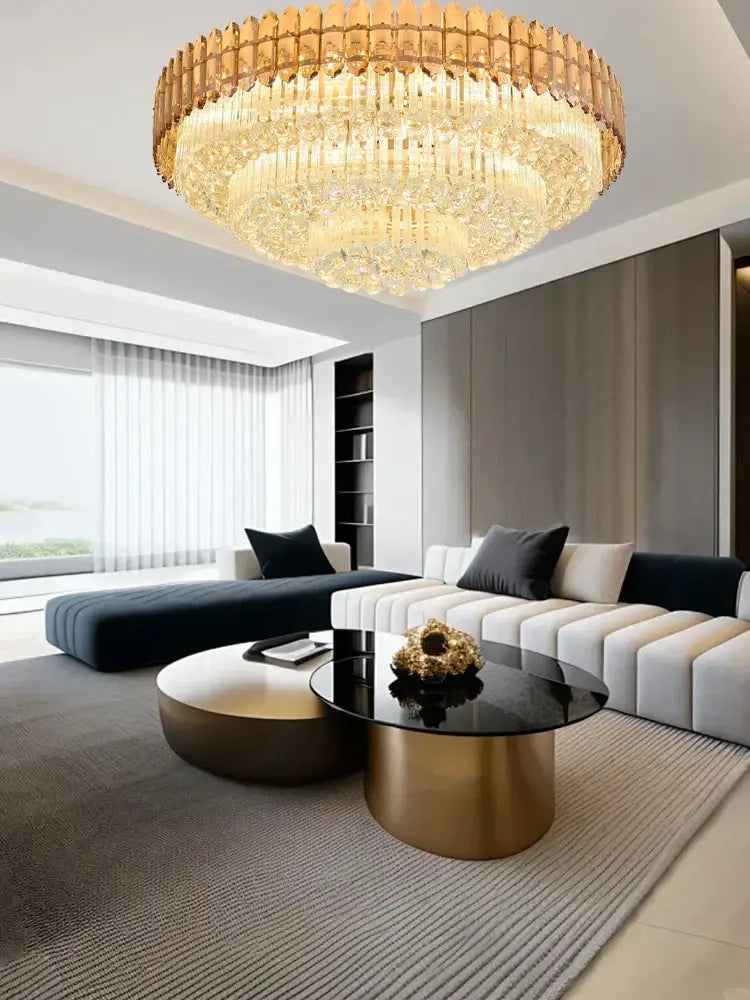 A luxurious gold-toned amber crystal round chandelier with multi-tiered faceted crystals for living room decor