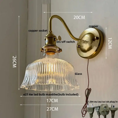 Vintage-style brass wall sconce with amber flower glass ribbed shade for living room and bathroom vanity lighting