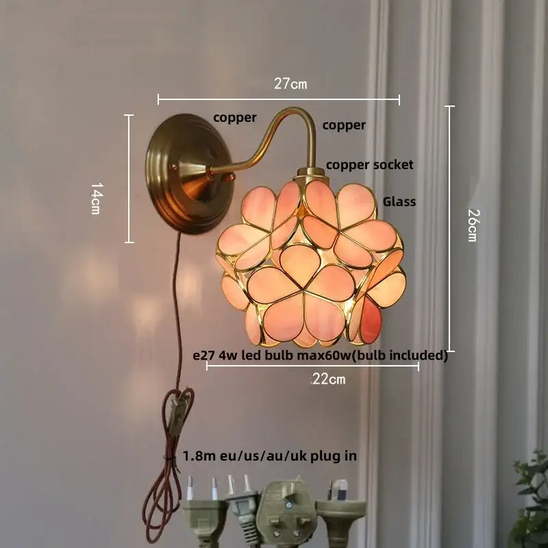 Copper-finished DecorBites amber flower glass wall sconce with pink and peach flower-shaped panels for living room