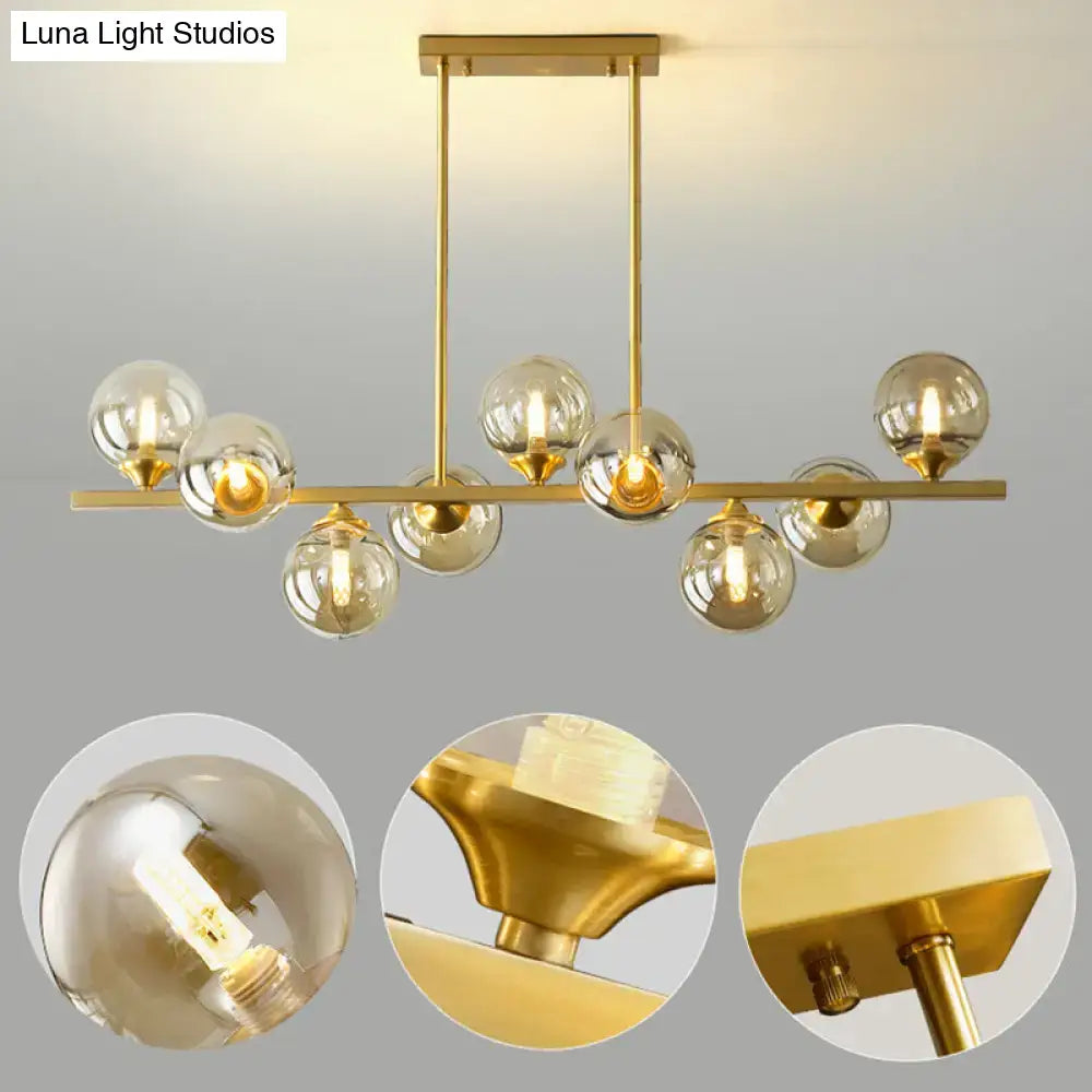 DecorBites™ amber glass bubbles island lamp with modern gold finish and clear glass globe bulbs for dining room lighting