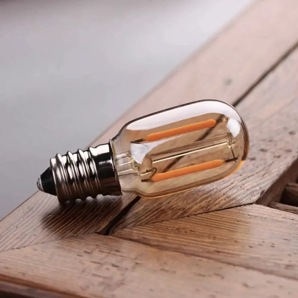 Decorbites amber glass dimmable led filament bulb with metallic screw base and visible internal filament