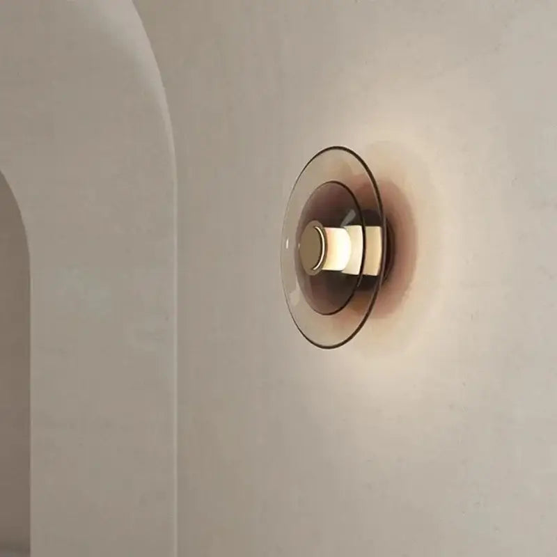 Decorbites amber glass disc wall lamp modern minimalist led wall lamp with translucent amber glass and metallic base emitting warm light