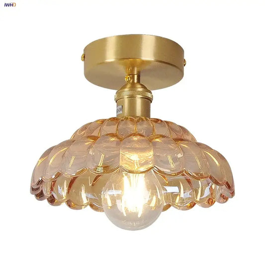 Gold-toned decorbites amber glass led ceiling lamp with scalloped amber-tinted shade and exposed bulb for indoor use