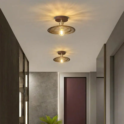 Two vintage-style decorbites amber glass led ceiling lights with warm bulbs and dark bronze metal shades for kitchen balcony
