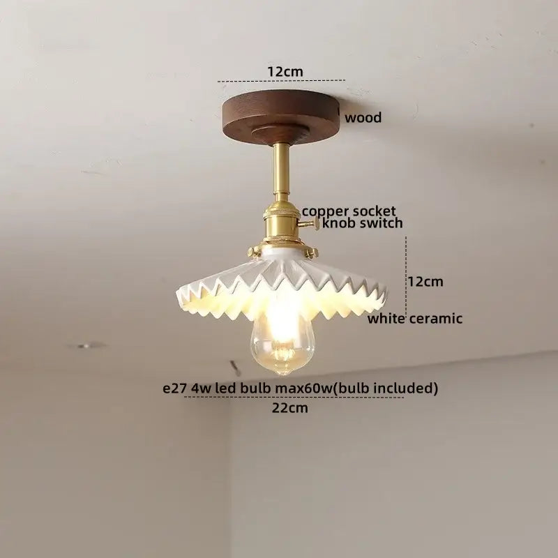 DecorBites™ ceiling light with dark wood base, brass socket, and white ceramic shade with scalloped edge design
