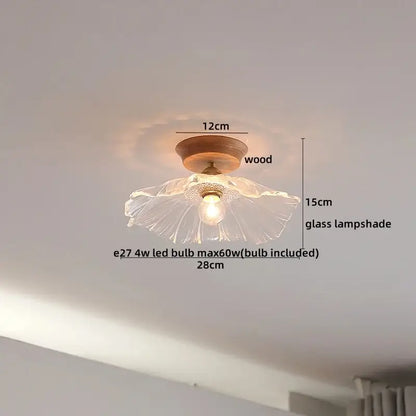 A delicate amber glass led ceiling light with a fluted design on a warm wooden base for modern home decor