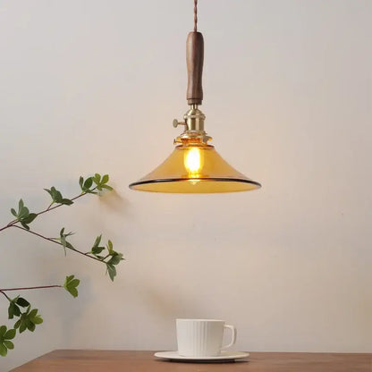 Decorbites amber glass led pendant light with warm amber glass shade walnut handle and brass hardware for dining room