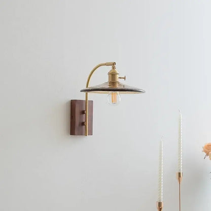 Brass wall lamp with dark translucent shade and exposed filament bulb decorbites amber glass led Nordic style