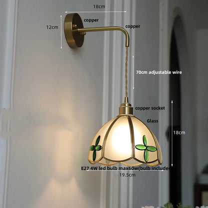 Decorbites amber glass led wall light with antique brass finish stained glass shade featuring green clover motifs