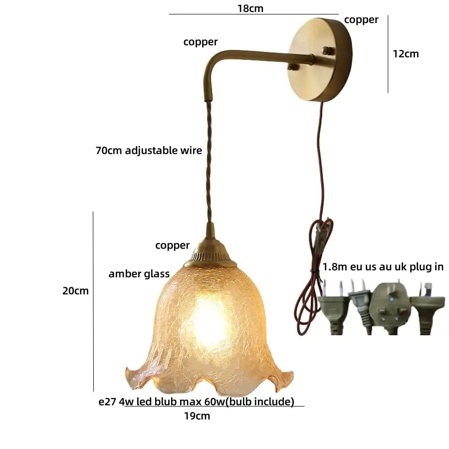 Antique brass-finished copper wall lights with a textured amber glass bell-shaped shade from decorbites amber glass led collection