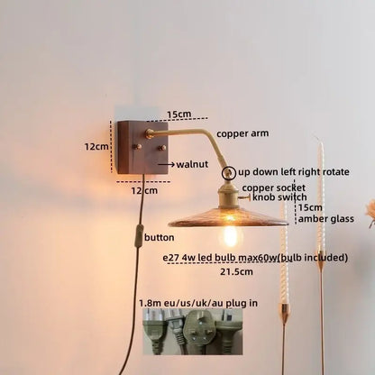 Decorbites amber glass led wall sconce with copper arm amber glass shade and walnut mounting plate with pull chain switch