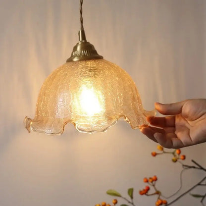 Decorbites amber glass led wall sconce with warm amber glass, textured crackled surface, scalloped edges, and pull chain switch