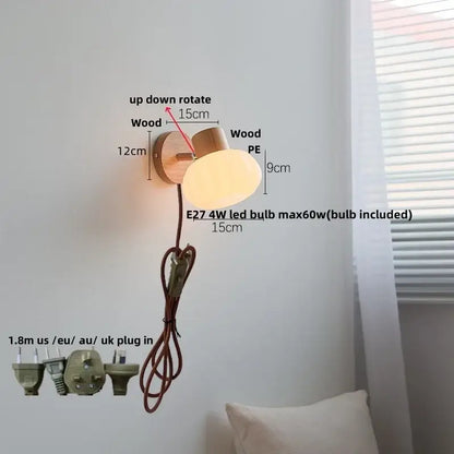 DecorBites amber glass wall sconce with amber glass led light, natural wood base, and soft beige lampshade in Nordic style