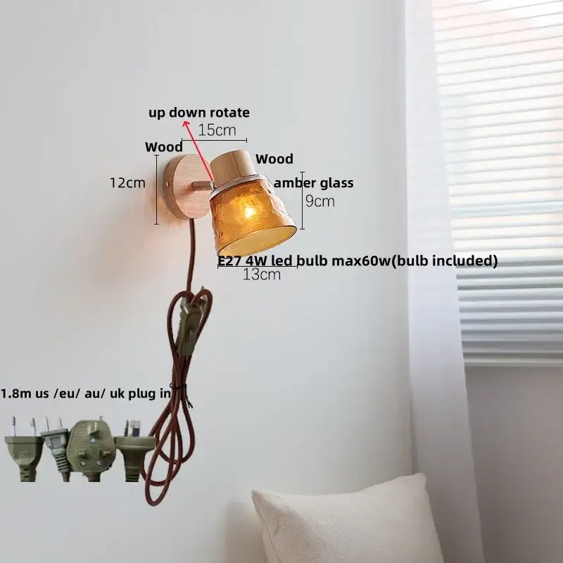 A decorbites amber glass led wall sconce with warm amber glass, natural wood base, and adjustable arm for stair lighting