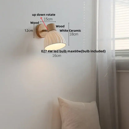 A warm-toned decorbites amber glass led wall sconce with ribbed white shade and natural wood mounting bracket for stairs