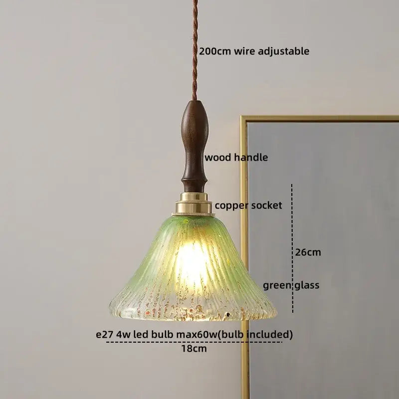 Vintage-style decorbites amber glass pendant with textured green glass shade, dark wood handle, and brass copper socket