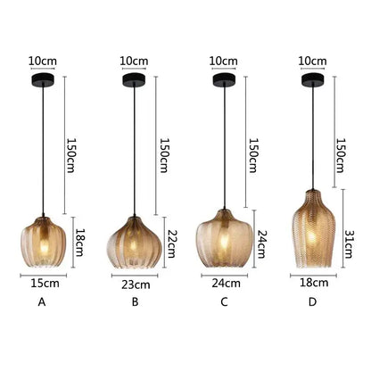 Four decorbites amber glass pendant lights with textured amber glass shades and black metal fixtures for kitchens and bedrooms