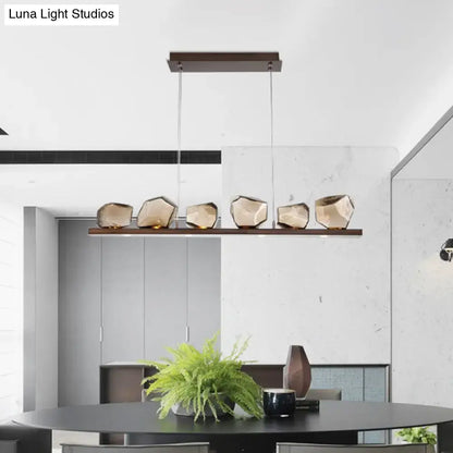 Modern geometric DecorBites amber glass stone pendant lamp with five faceted amber glass shades on dark wood bar 220v-240v 110v-120v