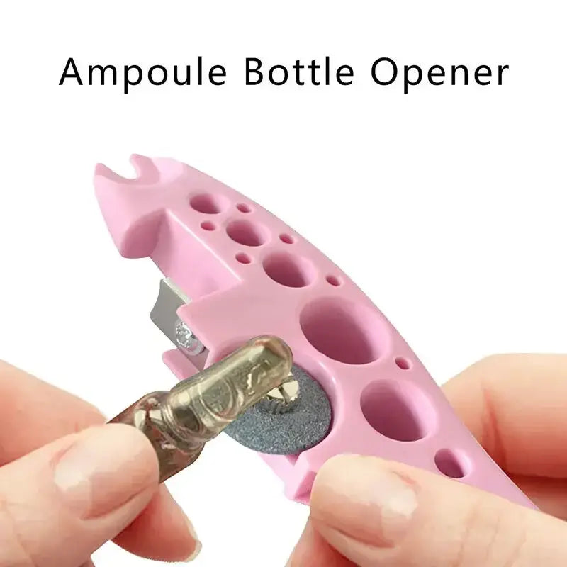 Pink plastic ampoule opener with metallic cutting edge and circular grinding surface for easy nurse assistant tool use