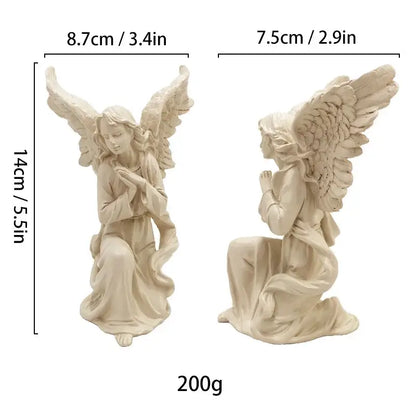 Two beige resin angel figurines kneeling with wings spread and hands clasped collectible statue for home decor