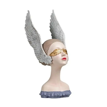 Sculpted angel girl statue with silver wings, golden leaf mask, and red lips for elegant room decor and gifts