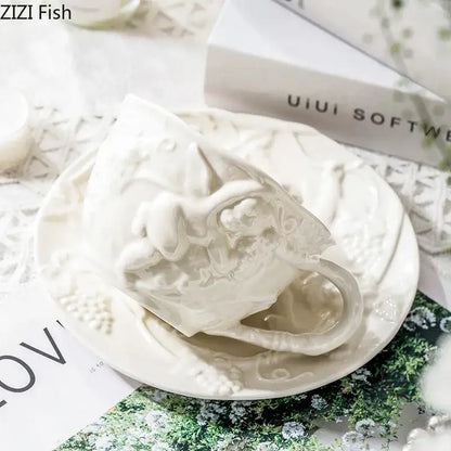 White ceramic teacup with intricate raised floral and vine detailing from decorbites angel relief ceramic tableware set