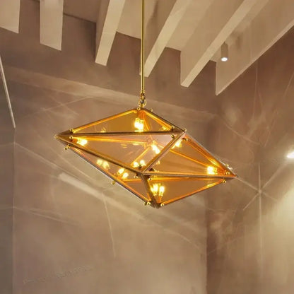 Golden angular diamond glass chandelier with amber-tinted panels and brass hardware for home decor ceiling light