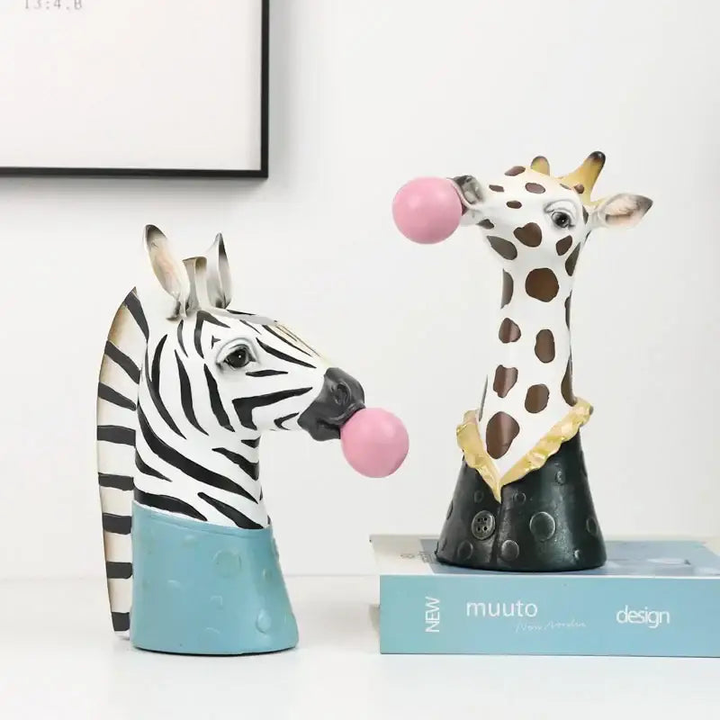 Whimsical white resin giraffe animal bust succulent with brown spots and gold-trimmed collar blowing pink gum