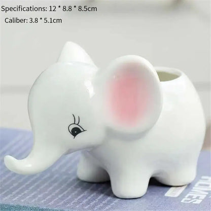 White ceramic animal cartoon ceramic elephant planter with pink inner ear and black eyelash detail for nursery planting
