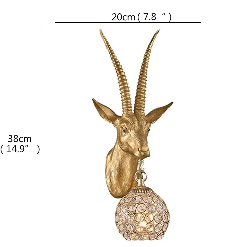 Gold-colored antelope head led wall light with crystal-encrusted globe for home bedroom decor by decorbites