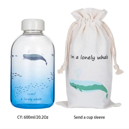 Decorbites™ animal glass water bottle in clear glass with gradient blue whale design and white screw-on cap for outdoor use